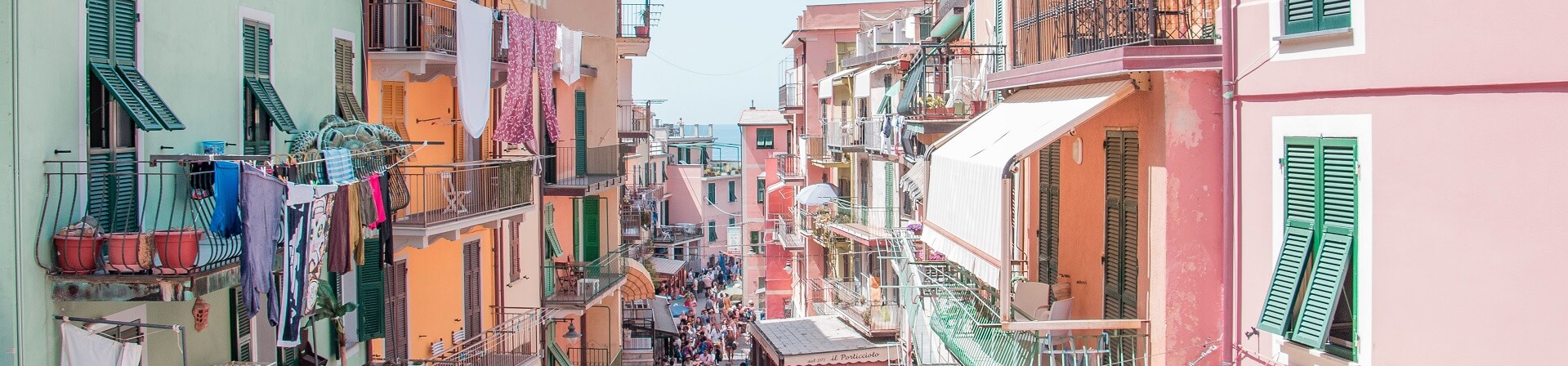 Is it better to stay in Cinque Terre or do a day trip?